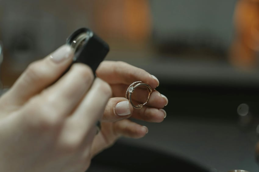 jeweller insepecting ring