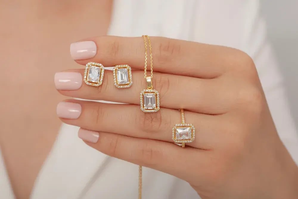 multiple diamond pieces womans hand
