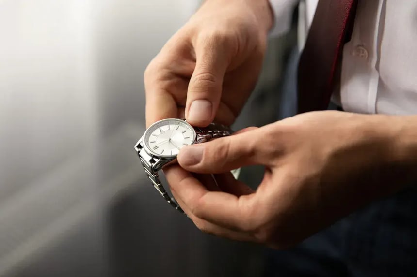man holding watch
