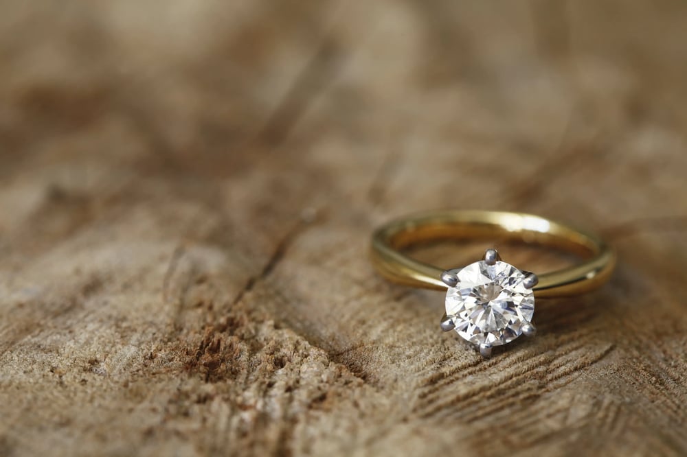 claw setting gold diamond engagement ring