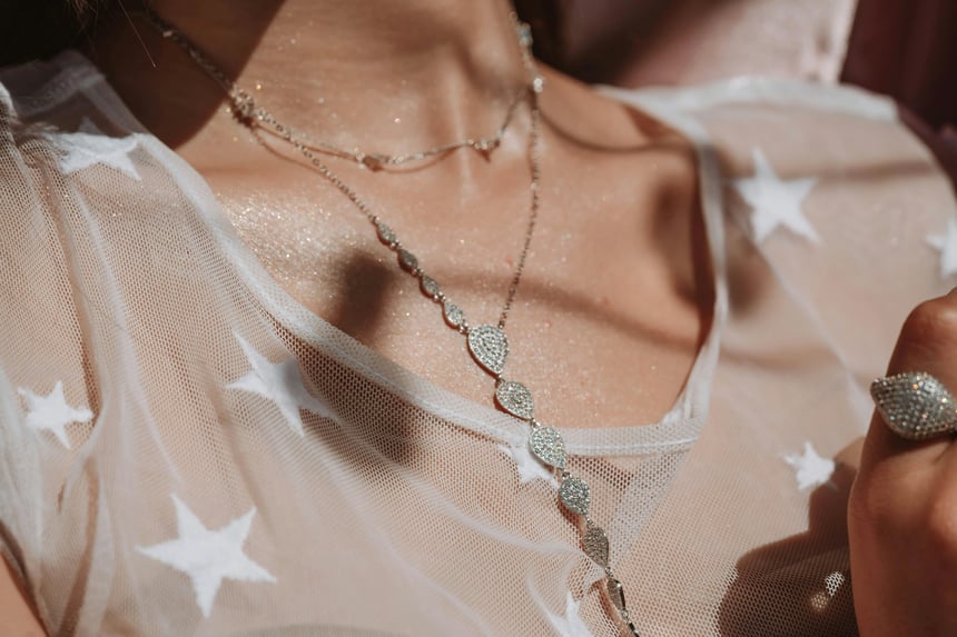 woman wearing long necklace
